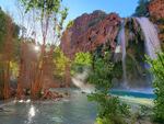 A photo shows Mooney Falls on the Havasupai reservation in Arizona in May. Dozens of tourists say they fell ill on a recent visit to a popular and picturesque stretch of waterfalls deep in a gorge neighboring Grand Canyon National Park.