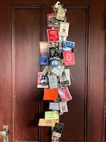 Dennis Darby's collection of concert badges hangs in his office at his house in Northeast Portland, Dec. 27, 2024.