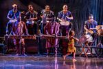 In this May 2024 performance photo provided by Sebé Kan, one of the youngest dancers in the troupe is pictured , along with troupe musicians, on stage at the Jefferson HS Performing Arts Auditorium.