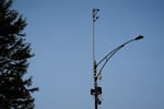 ShotSpotter equipment overlooks the intersection of South Stony Island Avenue and East 63rd Street on Tuesday, Aug. 10, 2021, in Chicago, where a lawsuit filed in federal court alleges that Chicago police misused the company's “unreliable” gunshot detection technology.