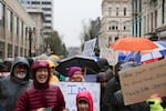Demonstrators march through the rain at the Women's March on Portland on Saturday, Jan. 21, 2017.