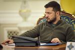 In this photo released by the Ukrainian Presidential Press Office, Ukrainian President Volodymyr Zelenskyy leads a meeting National Security and Defense Council meeting in Kyiv. He announced that his country is submitting an "accelerated" application to join the NATO military alliance.