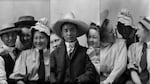 A collage of pictures of Frank Matsura and his two young women friends goofing around with their hats at his studio in Okanogan, Wash., circa 1912.