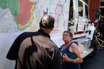 Rita MacDonald, a resident of Sisters for 35 years, asks an Oregon Department of Forestry fire official about evacuation orders that may impact her at the Sisters-Camp Sherman Rural Fire Protection District Fire Station 701 in Sisters, Ore., on July 24, 2026.