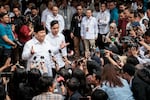 Indonesia's President-elect Prabowo Subianto (left) speaks to reporters with Vice President-elect Gibran Rakabuming Raka (second left) as they arrive at the plenary session of the General Elections Commission after his main rivals' challenges to his election victory were rejected in Jakarta, April 24.