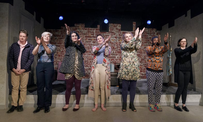 The cast acknowledge the rest of the production team and playwright Mikki Gillette at the conclusion of rehearsal.