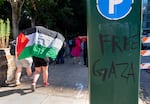 A small group of Portland State University students, alums and supporters march around the block, near the PSU Administration building, Oct. 7, 2024. 