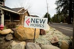 A sign advertises homes for sale in Sisters, Ore., in this March 18, 2017, file photo. The city is aiming to add around 250 more acres to its UGB and has proposed five possible areas to pull from, all rural-residential lands currently managed by the county.