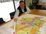 Dean Wise with J L Ward points to a plot of land just incorporated into Bend's new urban growth boundary.