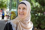 Behireta Corbadzic and her Indian ringneck parakeet, Kiwi.