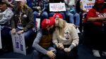 A couple kisses while waiting for the start of a campaign rally with Republican presidential candidate and former President Donald Trump at the Forum River Center March 9, 2024 in Rome, Ga.