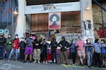 CHOP demonstrators link arms outside the East Precinct of the Seattle Police Department.
