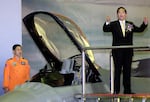 Taiwan's then-President Chen Shui-bian (right) gestures as he attends a ceremony in southern Chiayi airbase to put into force the island's first F-16 fighter wing, on Dec. 18, 2001. Chen warned of arch foe China's growing military threat and called for an arms buildup.