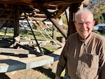 Wes Engstrom, 91, first came to Liberty, Wash., in 1971 in search of gold. He's standing in front of the town's oldest working mining equipment called an arrastra.
