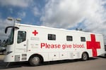 A mobile donation vehicle used by the American Red Cross. Red Cross implemented safety protocols for the pandemic, including spacing beds 6-feet apart, requiring face masks, and additional wipe downs of donor areas.