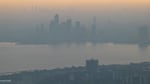 Smoke and haze from wildfires in the provinces of Quebec and Nova Scotia blurs the cityscape of Toronto in late June.