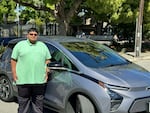 Arvind Srinivasan, pictured with his Chevy Bolt, wished there were more options when he was shopping for an affordable EV.