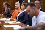Guillermo Raya Leon, second from left, looks on as Gage Brown, right, son of Clark County sheriff's Sgt. Jeremy Brown, speaks to the court during Raya Leon's sentencing at the Clark County Courthouse in Vancouver, Wash., on Thursday morning, Oct. 5, 2023. Raya Leon was sentenced to life in prison after he was found guilty of aggravated first-degree murder in the 2021 fatal shooting of Sgt. Brown.