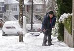 Myron Lee shovel, sidewalks in the Sylvan Hills neighborhood