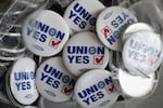 UAW pins that say "Union Yes" are available at the union hall.