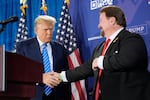 Michael McDonald, the chair of Nevada’s Republican Party, shakes hands with former President Donald Trump at a January event for Trump’s reelection campaign in Las Vegas. McDonald is one of this year’s 14 presidential electors who are linked to efforts to reverse Trump’s 2020 defeat.