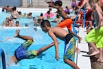 Kids enjoy one of Portland's outdoor pools. This year, long lines are expected for swim lessons.