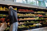 A customer shops for produce in an H-E-B grocery store on May 11 in Austin, Texas.