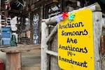 A sign supporting citizenship for American Samoans is posted outside the Log Cabin Gifts store on the waterfront in Whittier, Alaska, May 13, 2025.