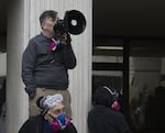 FILE - A protester with a megaphone outside the Eugene Federal Building, Jan. 30, 2026.