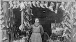 

Nessim Menashe in front of his new and secondhand shoe store in Northwest Portland, which operated until 1921. Circa 1916. 