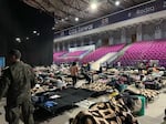 Ukrainians sleep on cots inside of a pop-up refugee center in Poland where Portland doctor Joe Howton helped triage patients and delivered medical supplies.
