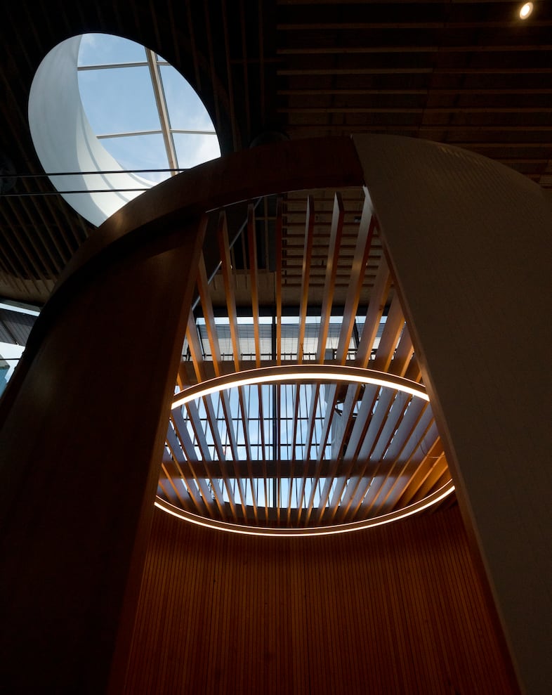 Light streams through a skylight, left, and through the ceiling of in enclosed inspection room inside the TSA screening area to give travelers more privacy during additional screening processes, Aug. 2, 2024.