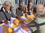 Elk Island Operations Manager Bernie Woodard, right, helps new Parker's Place Village residents fill out paperwork. Shown Aug. 4, 2026.