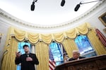 Musk speaks alongside President Trump in the Oval Office on Feb. 11, 2025.