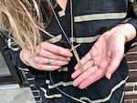 Betsy Cross of Portland’s Betsy & Iya jewelry design displays Luna, a needle sizer on a 30-inch chain, made of brass (shown) or sterling silver. The necklace, holes identifying knitting needles sized 0 to 10, is an exclusive collaboration with Knit Purl, one of 11 shops on the 2018 Rose City Yarn Crawl.  