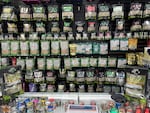 Shelves festooned with kratom powders, capsules, liquids and extracts greet customers at Tifton Tobacco & Vapor in Tifton, Ga. Kratom is a billion-dollar business in the U.S., according to the American Kratom Association.