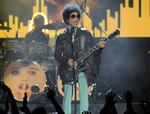 In this May 19, 2013, file photo, Prince performs at the Billboard Music Awards at the MGM Grand Garden Arena in Las Vegas. Prince, widely acclaimed as one of the most inventive and influential musicians of his era with hits including "Little Red Corvette," ''Let's Go Crazy" and "When Doves Cry," was found dead at his home on Thursday, April 21, 2016, in suburban Minneapolis, according to his publicist. He was 57.