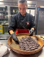 Safiya Reed plates blueberry hoecakes in the kitchen of The Allison Inn & Spa in Newberg, Ore. on Nov. 22, 2025. Culinary students from Siletz Valley School were invited to help with a First Foods dinner while shadowing world-renowned Indigenous chefs.