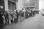 Despite sub-freezing temperatures and rain, a crowd waits in line outside the Paramount Theater in New York City, Feb. 4, 1974, for a showing of "The Exorcist." 