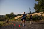 Runners in the Vernonia Marathon pass by Greenman Field on the Banks-Vernonia State Trail.