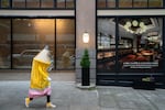 J. Schuberth, who is running for Oregon governor as “Pencil” and dresses the part, walks around downtown Portland, Ore., to campaign and meet voters on April 23, 2026.