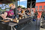 A group of spice enthusiasts battle to take down 20 dollops of wasabi in the quickest time at the first annual WasabiFest.