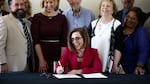 Gov. Kate Brown signs Senate Bill 1008 into law at the June Key Delta Community Center in Portland, Ore., Monday, July 22, 2019. The law brings reform to Oregon's juvenile justice system.
