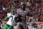 Utah running back Tavion Thomas (9) runs into the end zone during the second half of an NCAA college football game against Oregon Saturday, Nov. 20, 2021, in Salt Lake City.