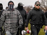 Proud Boys members Joseph Biggs, left, and Ethan Nordean, right with megaphone, walk toward the U.S. Capitol in Washington, Jan. 6, 2021.