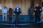 Mayor Ted Wheeler speaks to the media about protests against systemic racism and police violence in front of a beauty supply store located in the same building as PPB's North Precinct. The night before, police used tear gas and impact munitions to disperse protesters who then set a small fire next to the building. 