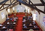 People gather at Bethany Lutheran Church to celebrate the transfer of the land to NAYA.