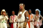 FILE - Tim Curry performs a number from the musical "Spamalot" during the Broadway premiere on March 17, 2005, in New York.