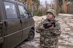 Inna, 51, is seen during the training with the Maxim machine gun on top of the car in Kyiv region, Ukraine on Nov. 9, 2024.