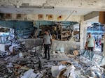 Civil defense teams and others carry out search and rescue operations after an Israeli strike on a school that was sheltering families at Nuseirat Refugee Camp in the Gaza Strip on Wednesday.